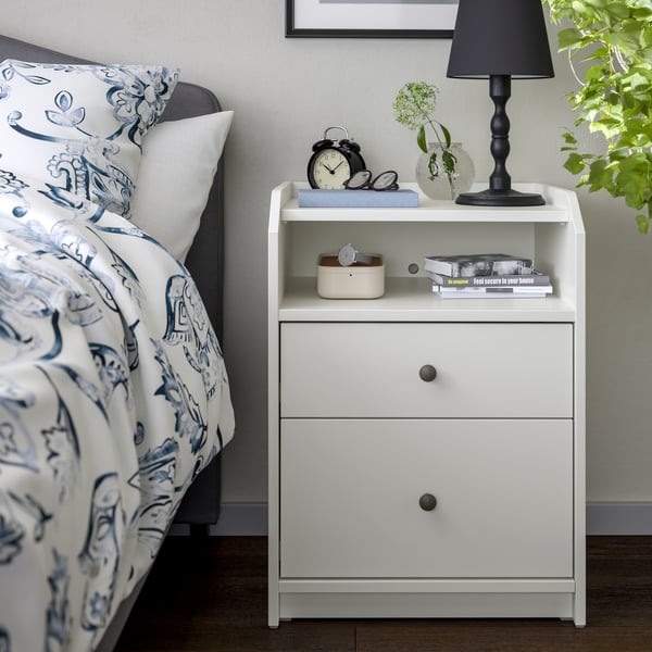 A white HAUGA chest of 2 drawers in the bedroom