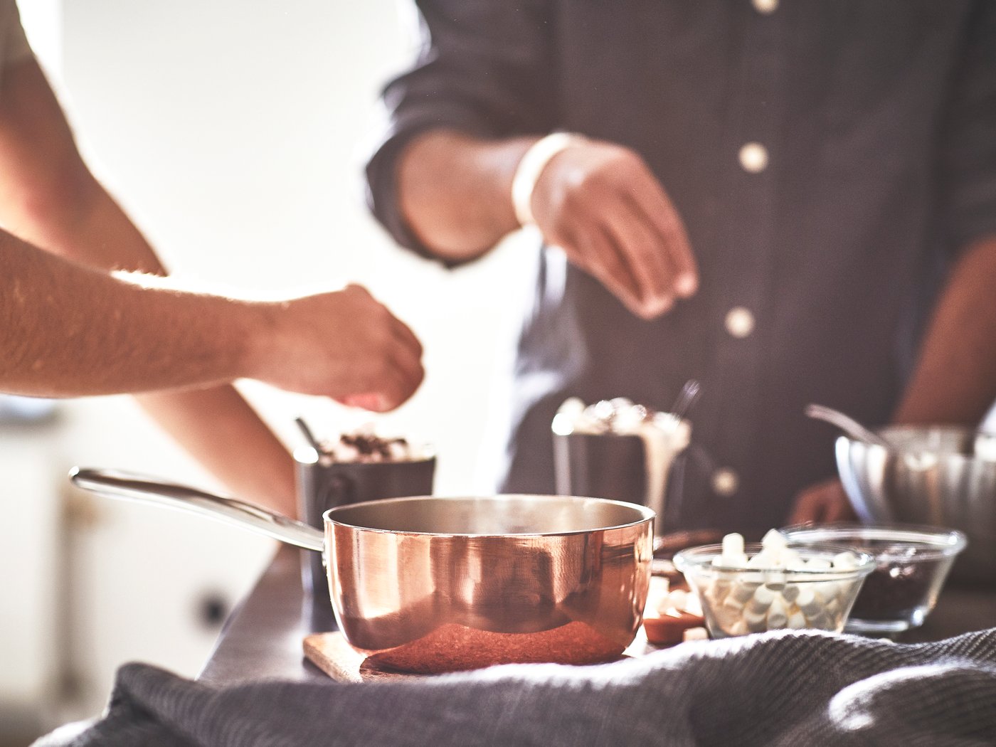 A copper/stainless steel FINMAT saucepan with lid