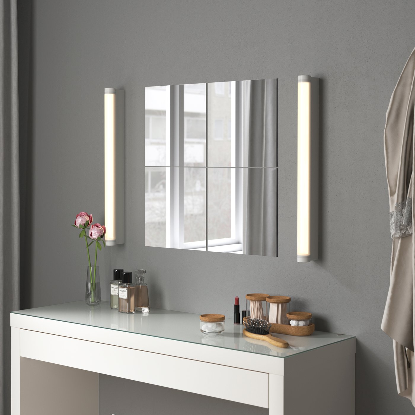 Four square BLODLÖNN mirrors are bookended by two vertical wall lamps above a white getting ready table/vanity area.