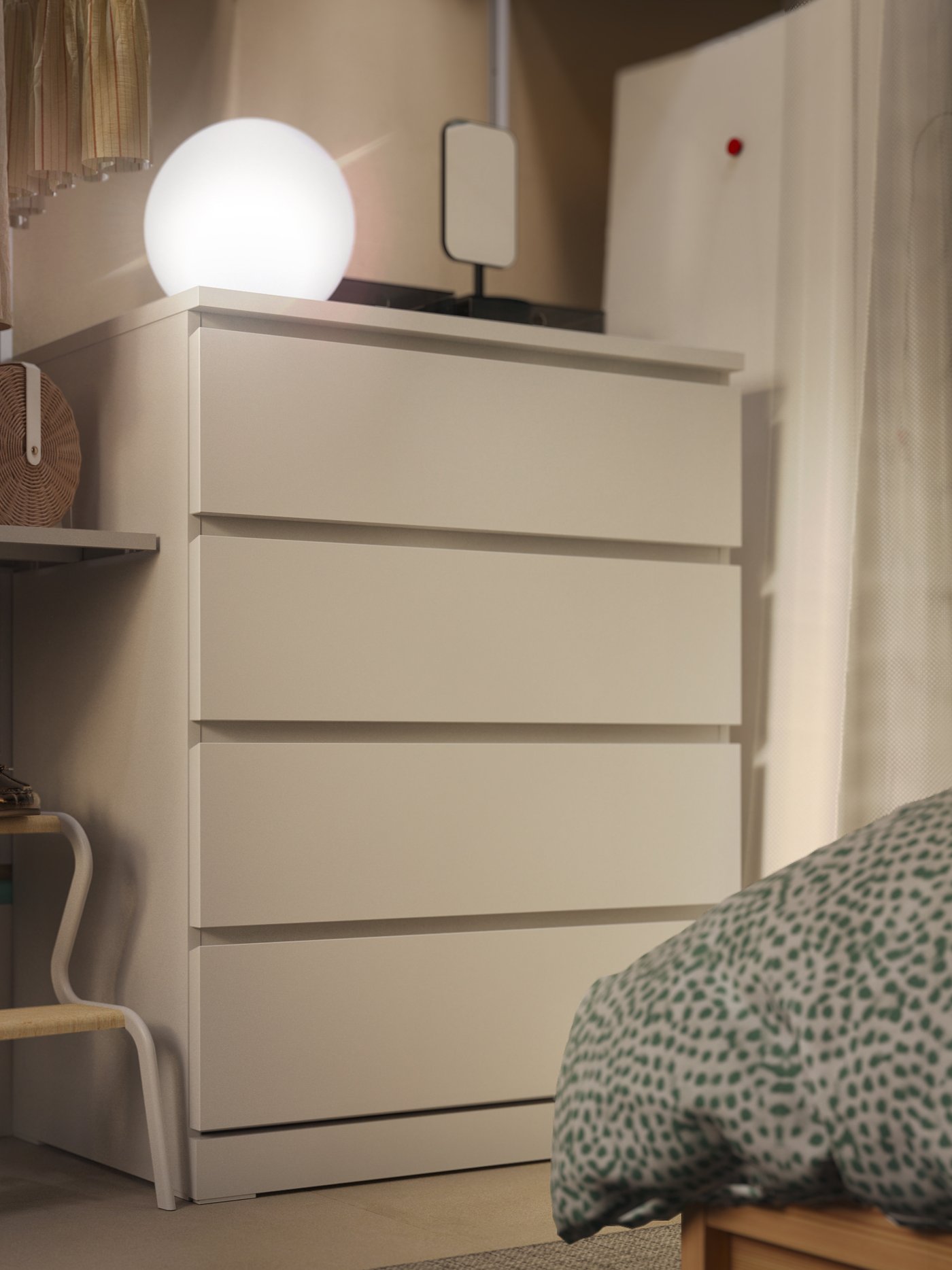 A white MALM chest of 4 drawers