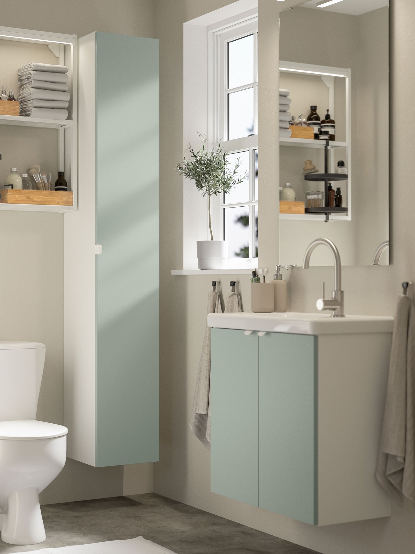 A white/pale grey-green TVÄLLEN wash-stnd w doors/wash-basin/tap