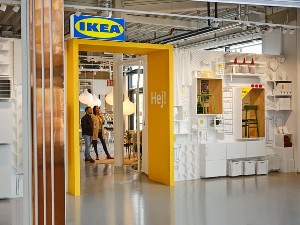 Inside the IKEA store, there is a yellow doorway with 