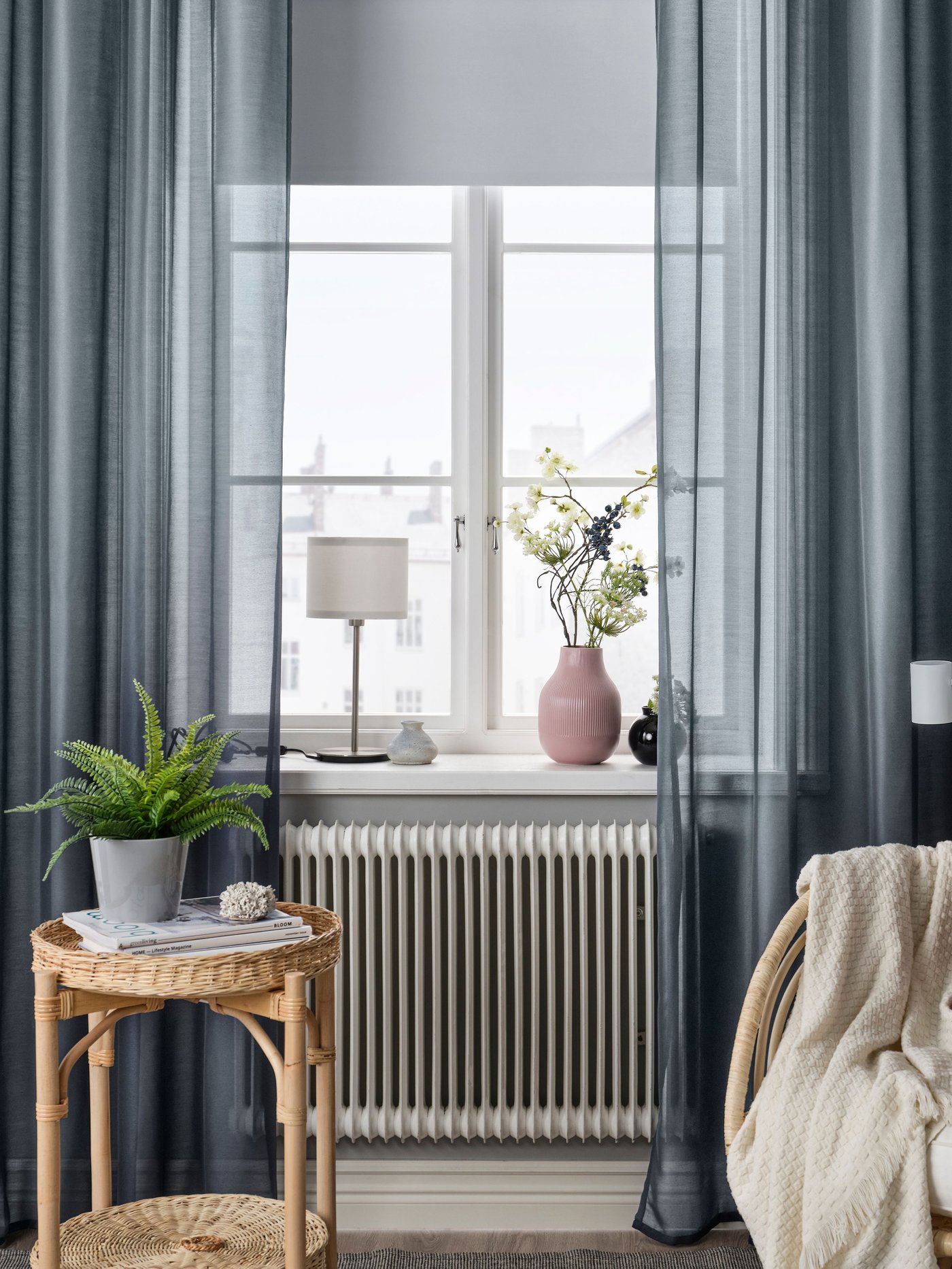 A white FRIDANS block-out roller blind