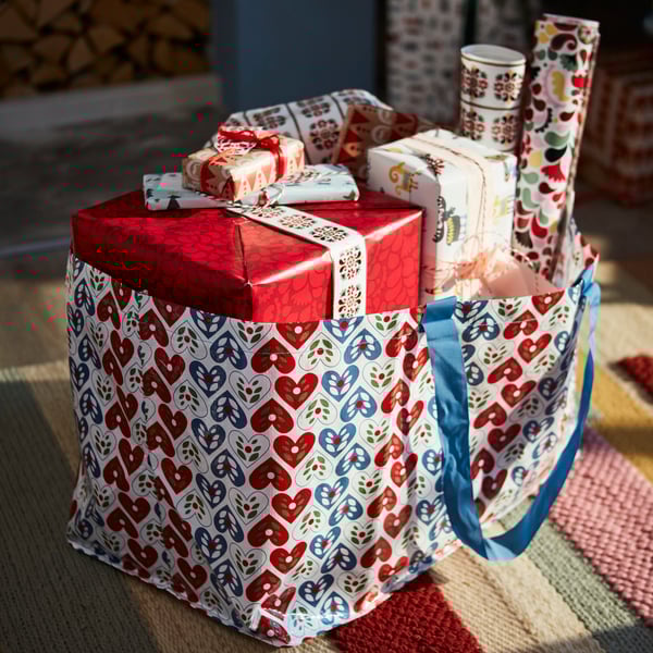 VINTERFINT large carrier bag filled with christmas gifts and wrapping papers.