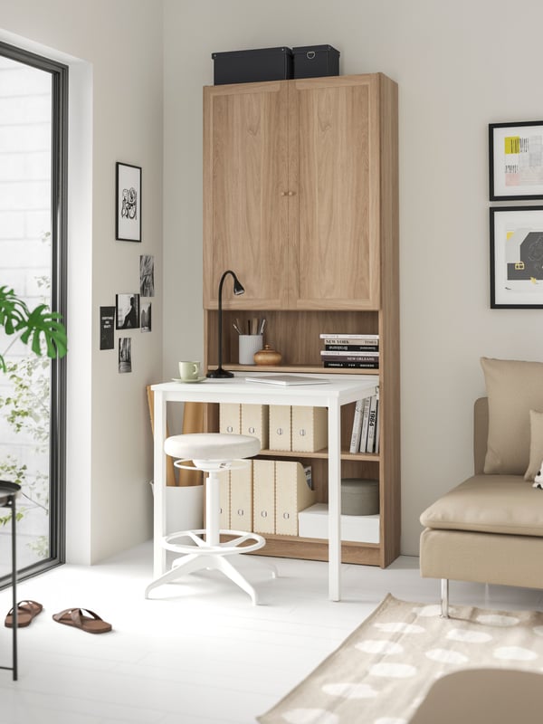 An oak effect/white BILLY Bookcase with desk
