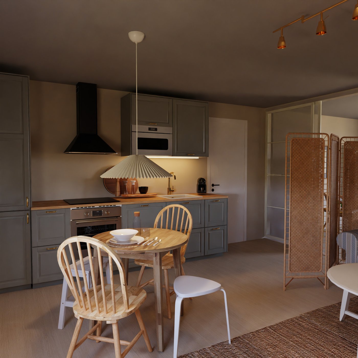 graue Landhausküche mit schwarzer Dunstabzugshaube und Essplatz davor.