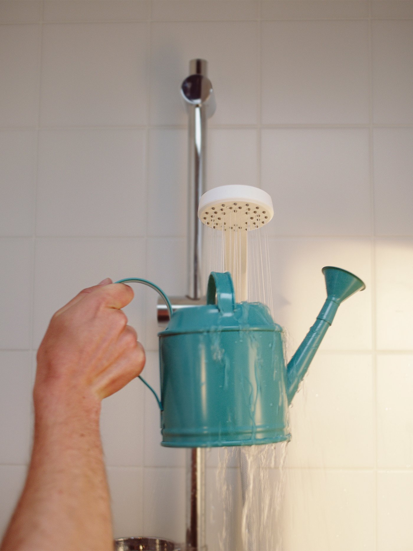 A white LILLREVET single-spray handshower in the bathroom