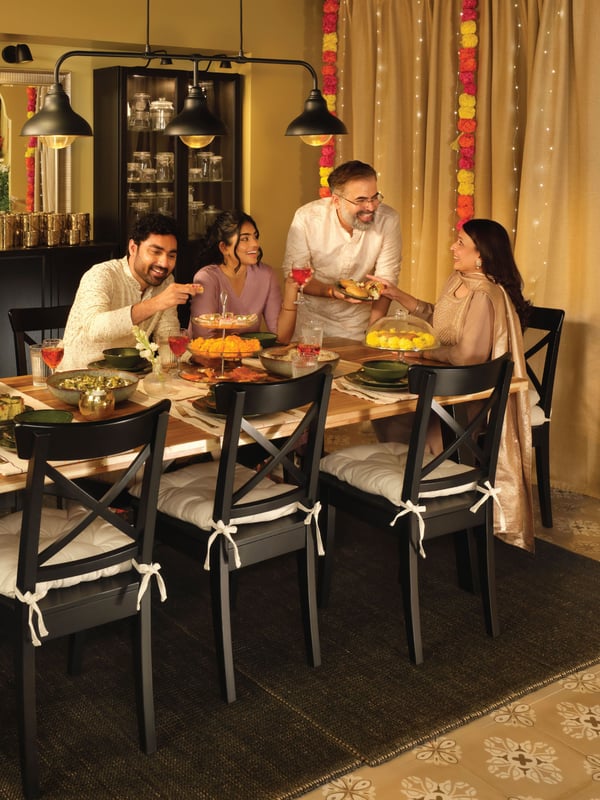 An acacia/black NORDVIKEN table and 6 chairs