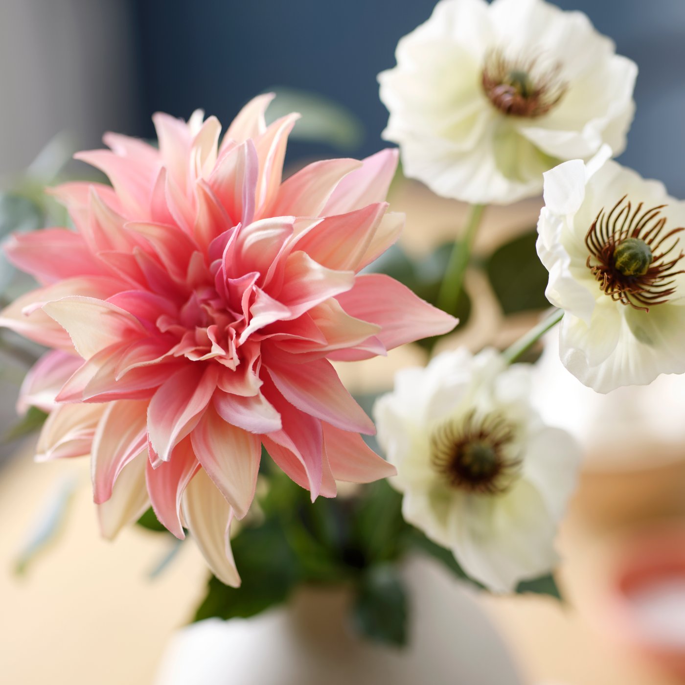 Pink and white SMYCKA artificial flowers arranged in a vase.