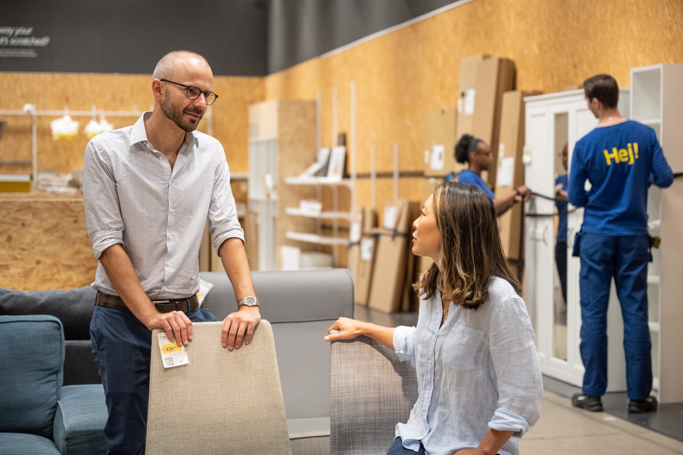 A couple chatting in the IKEA As-is.