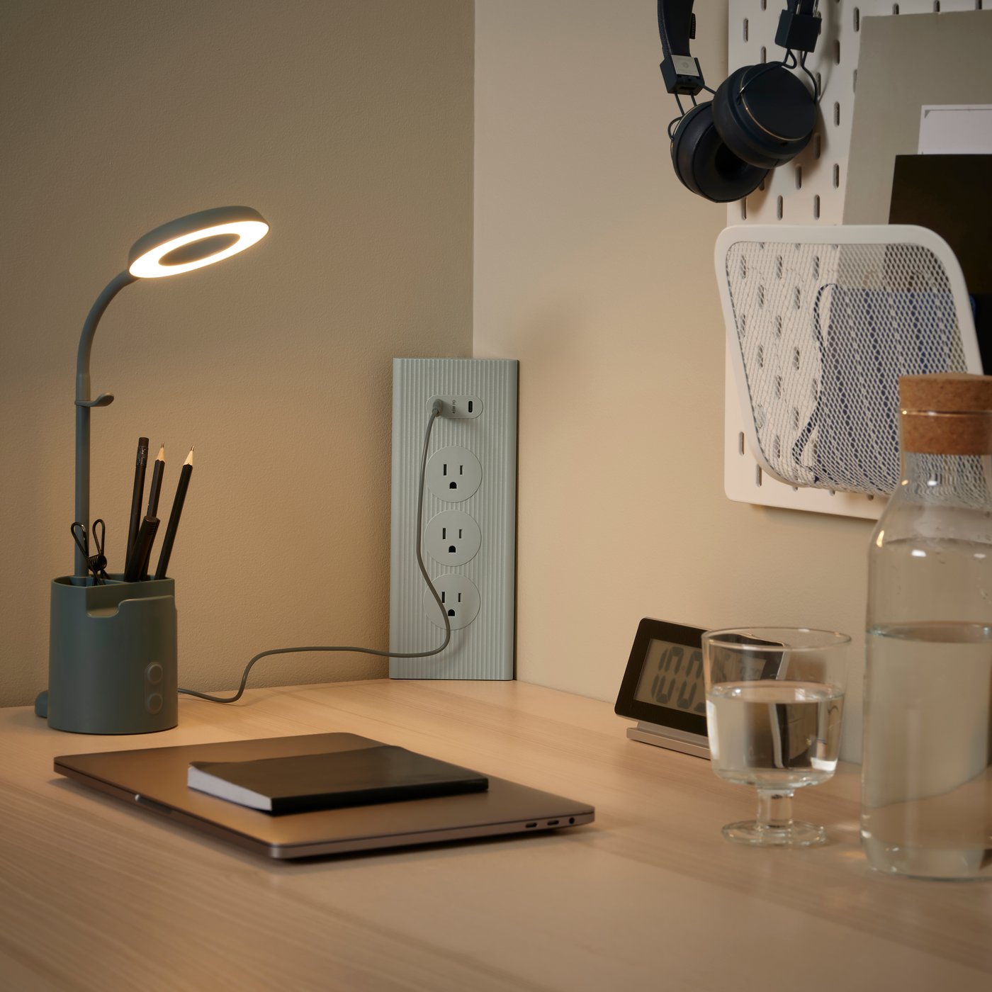 A green SKOTAT extension cord