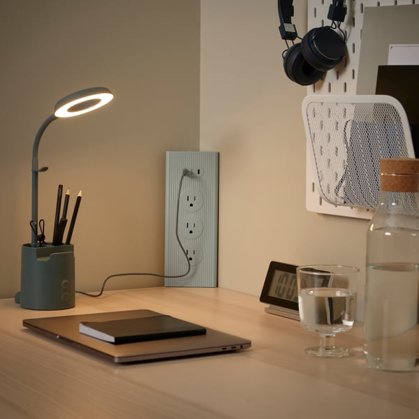 A green SKOTAT extension cord