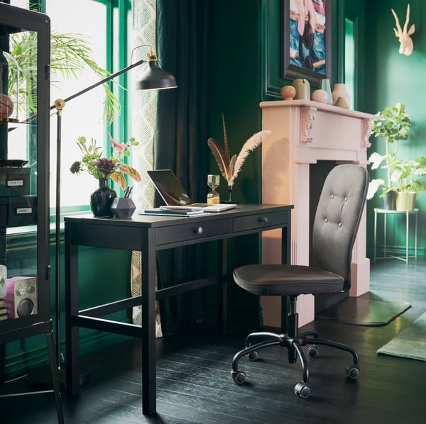 A dark grey FABRIKÖR glass-door cabinet in the home office