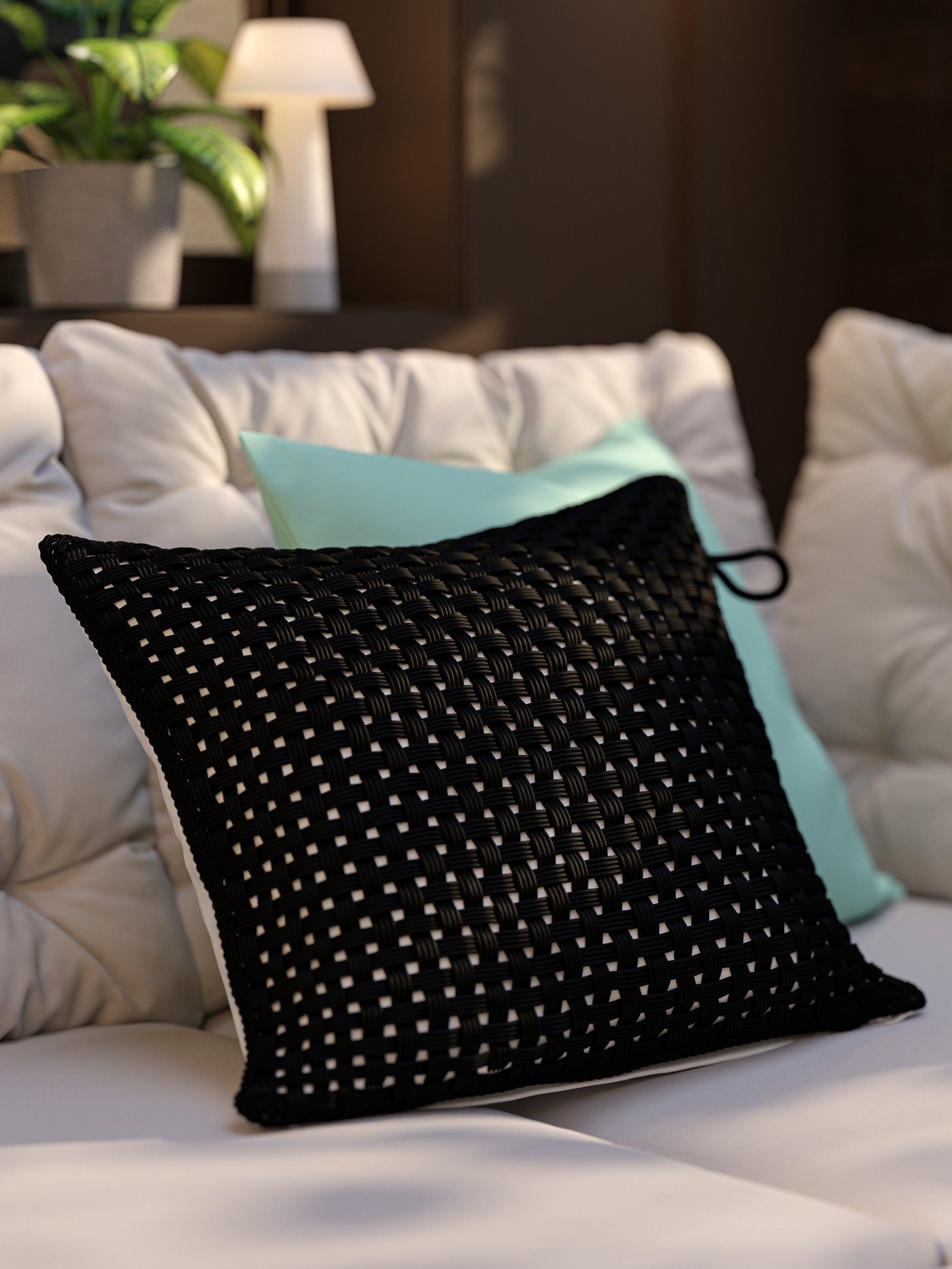 Une terrasse avec canapé d’angle d’extérieur, coussins gris-beige et oreiller avec housse TOFTÖ extérieur/intérieur noire.