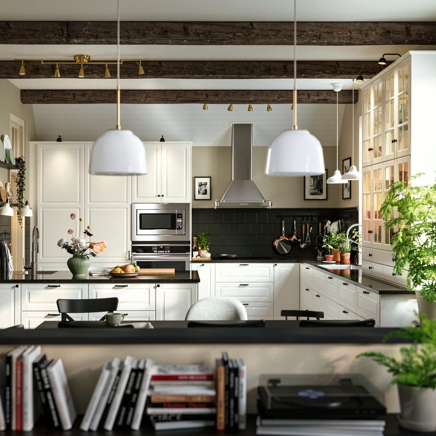 BODBYN kitchen fronts in off-white in a kitchen with pendant lamps, black tiles and extractor hood in stainless steel.
