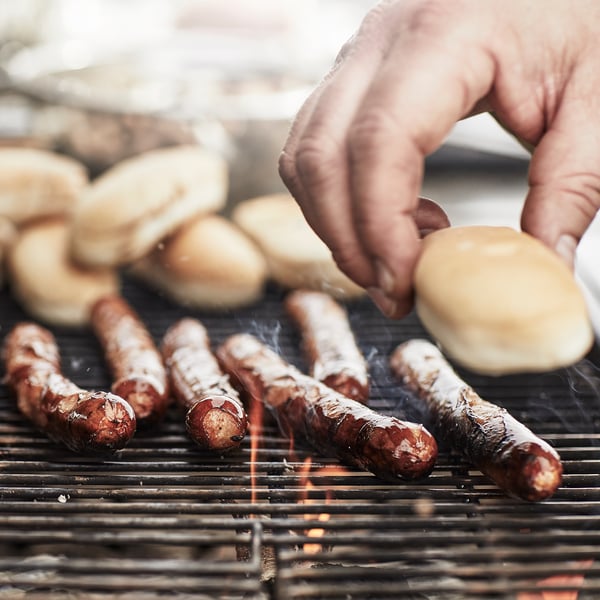 A black/stainless steel outdoor GRILLSKÄR charcoal barbecue