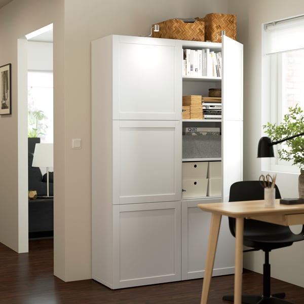A white/Hanviken white BESTÅ storage combination with doors
