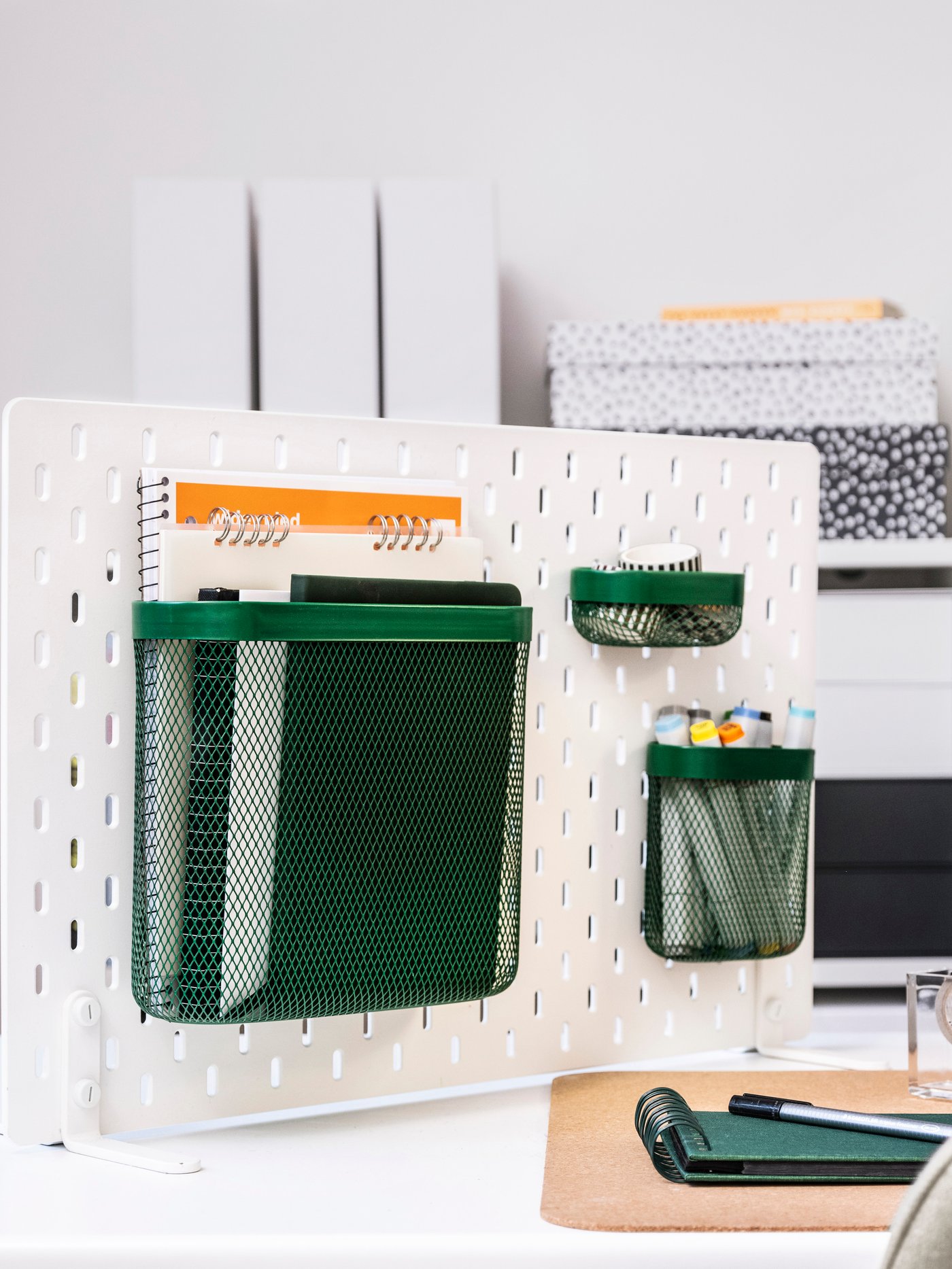 A green SKÅDIS storage basket