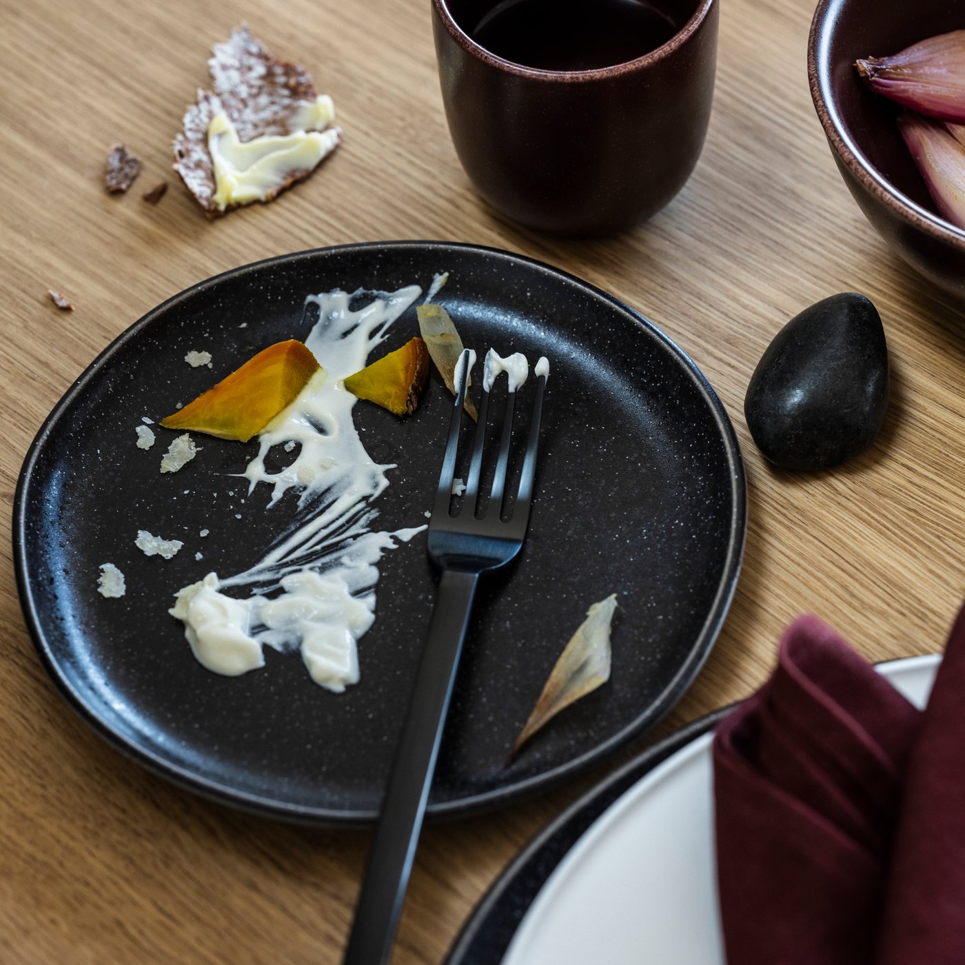 A black STOCKHOLM 2025 24-piece cutlery set