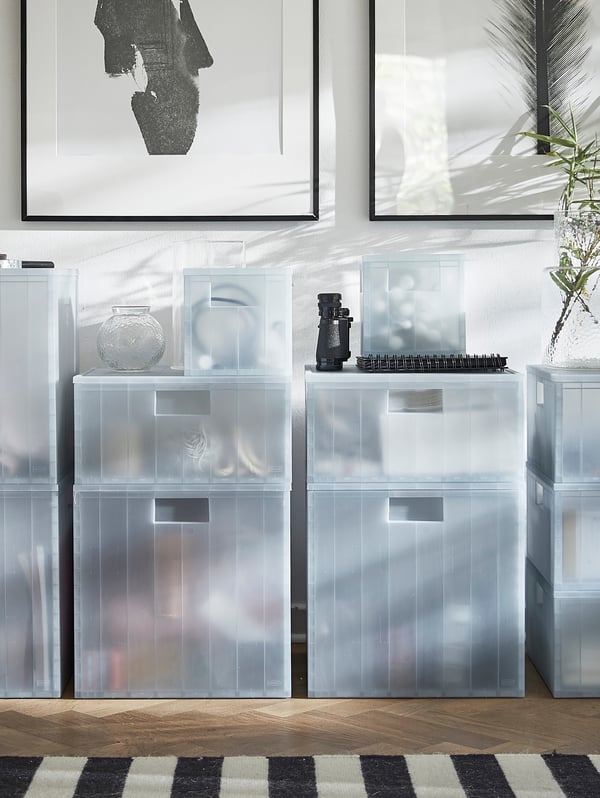 A transparent grey-blue PANSARTAX storage box with lid