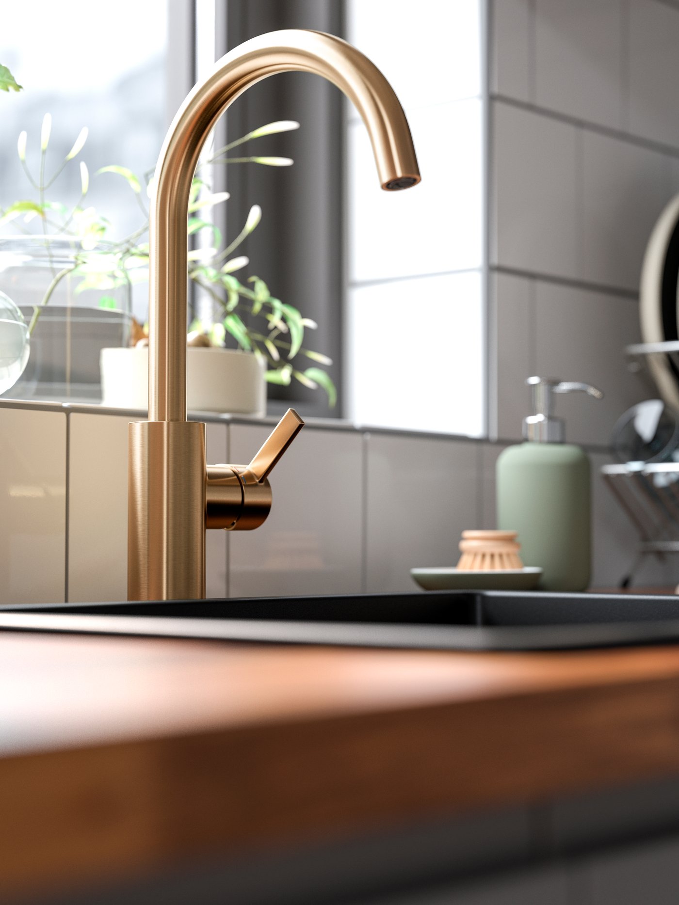 A brass-colour DELSJÖN kitchen mixer tap