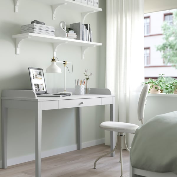 A light grey SMYGA desk
