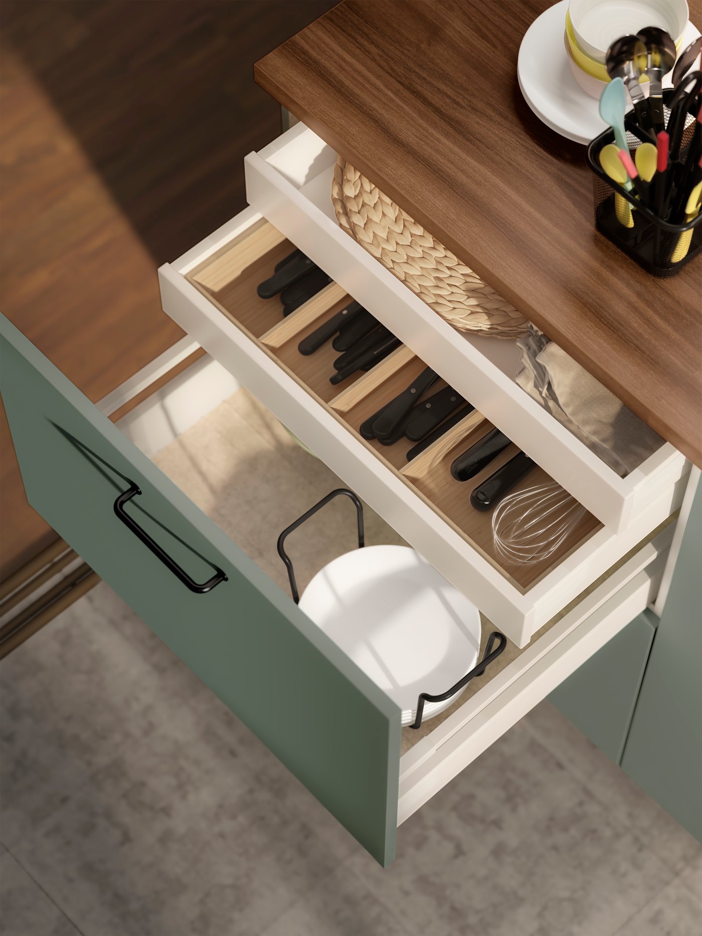 A light bamboo UPPDATERA cutlery tray in the kitchen
