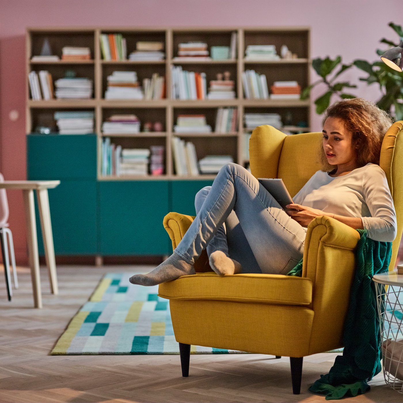 A Skiftebo yellow STRANDMON wing chair