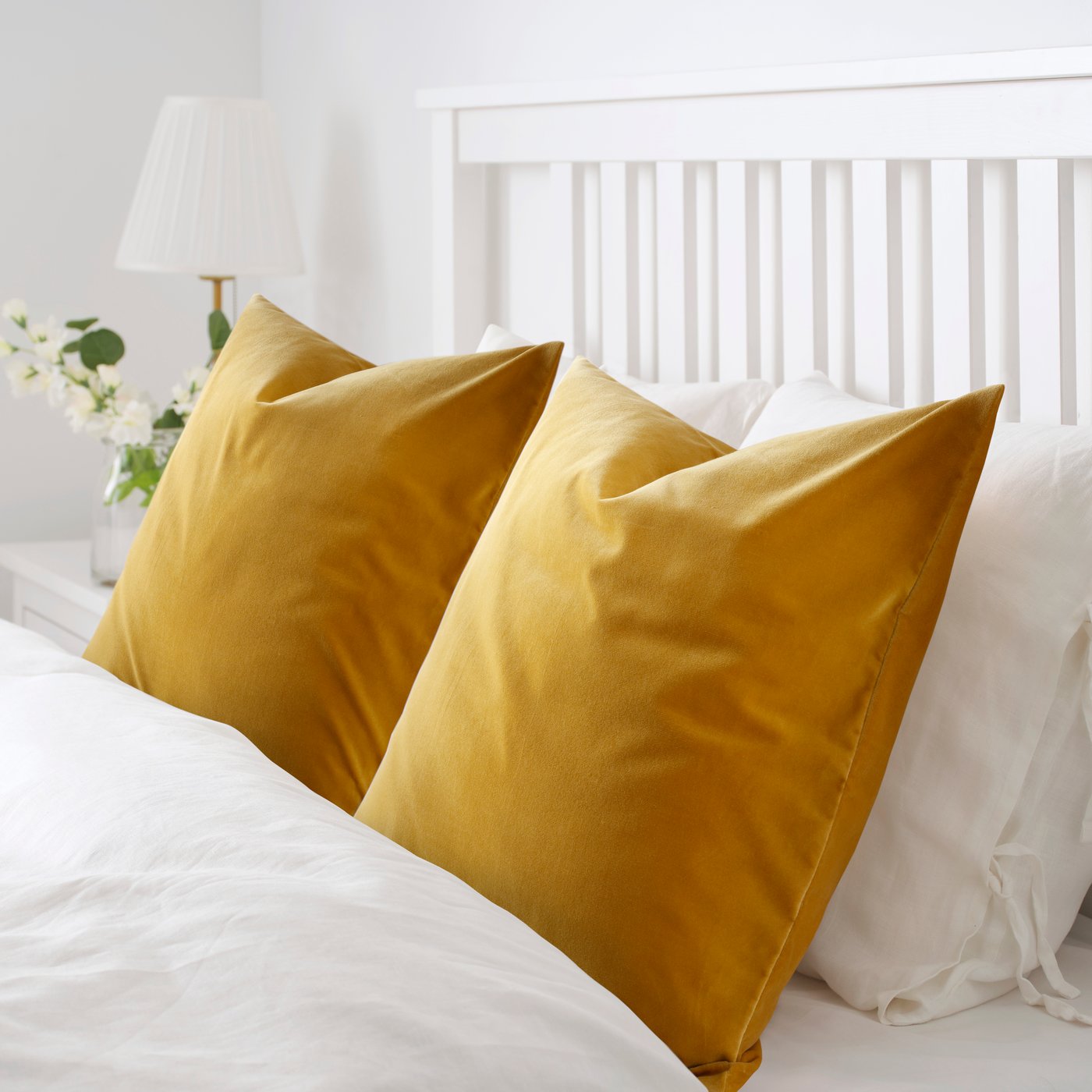 A golden-brown SANELA cushion cover in the bedroom