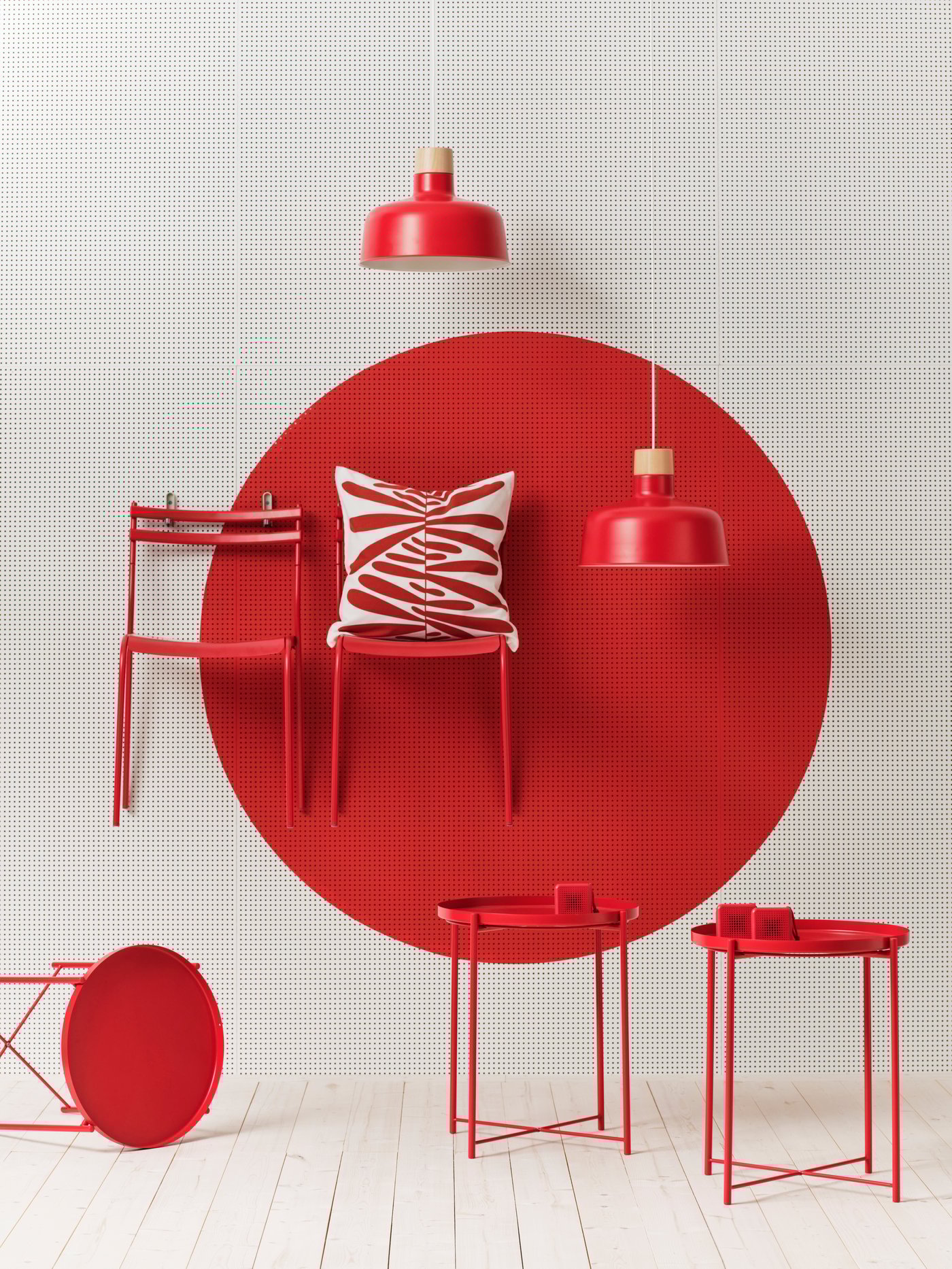 A set of IKEA products in red colors against a photo studio with a white background and white floor.
