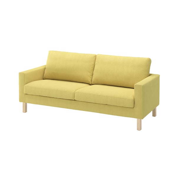 Un canapé SALTSJÖBADEN  avec une housse jaune