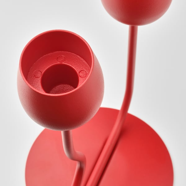 A bright red SILVERPÄRON candlestick/tealight holder