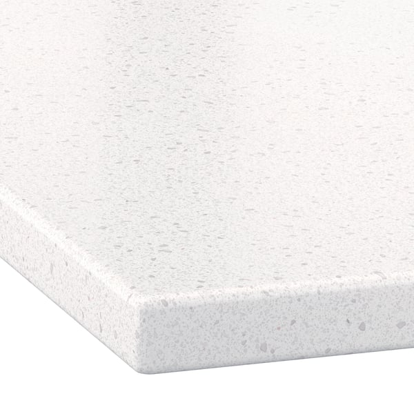 Close-up of a white countertop with a smooth matte finish and fine gray speckled pattern.