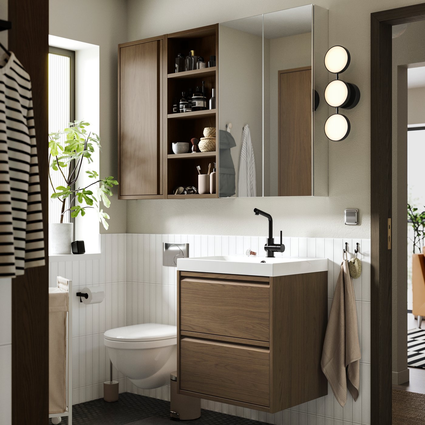 A brown oak effect ÄNGSJÖN wash-stand with drawers in the bathroom