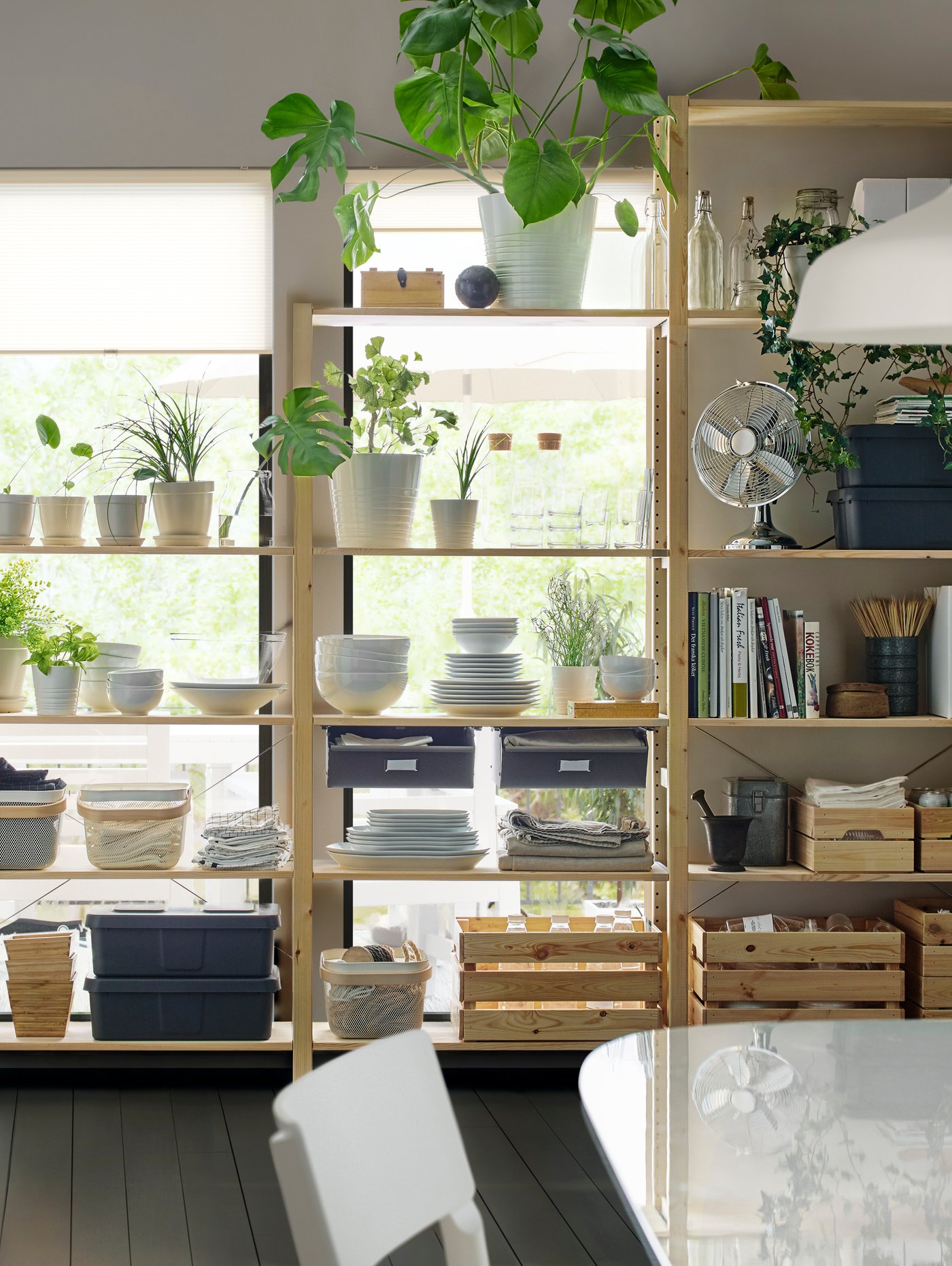 A pine IVAR shelving unit in the kitchen