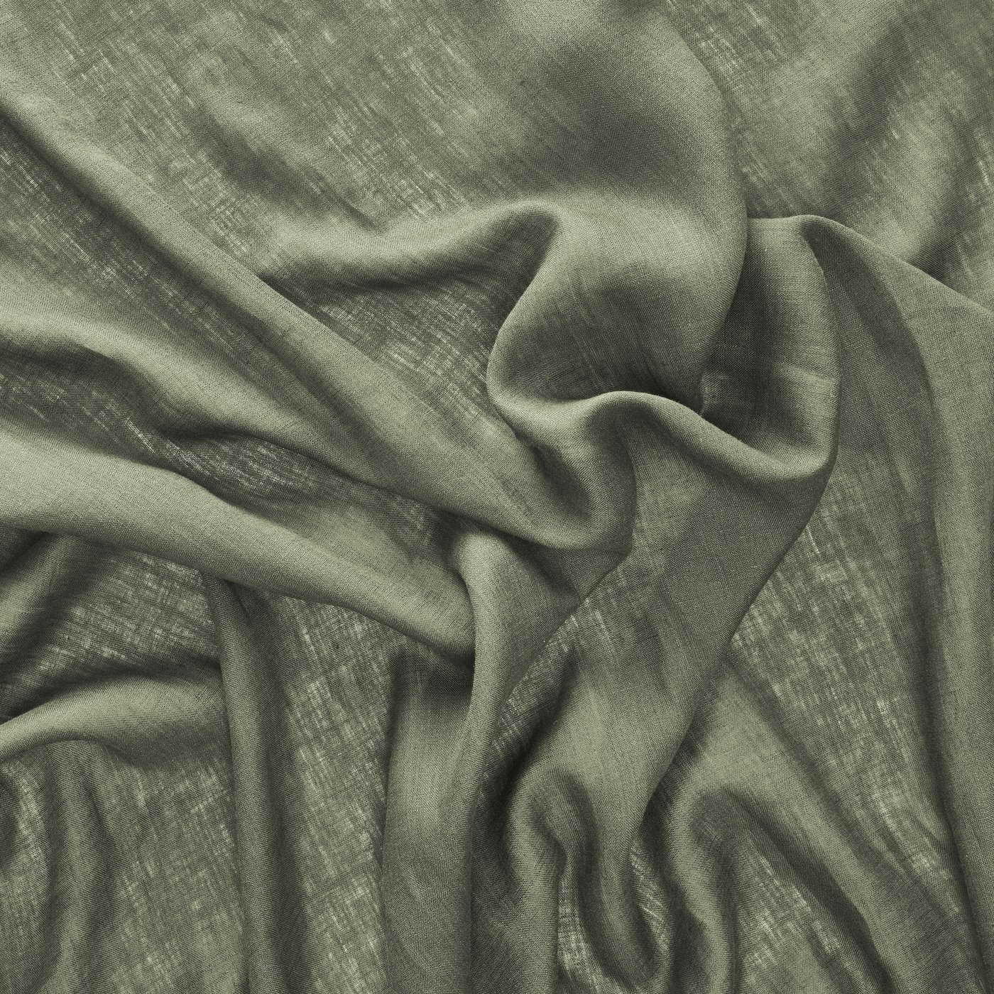 Närbild på grönt gardintyg.