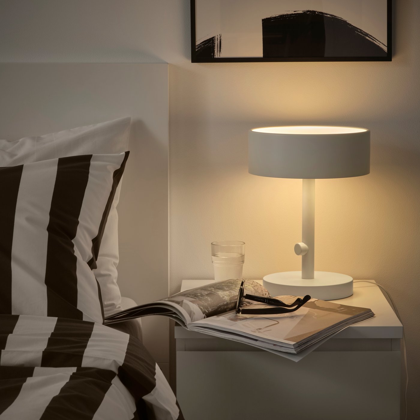 A white NYMÅNE table lamp