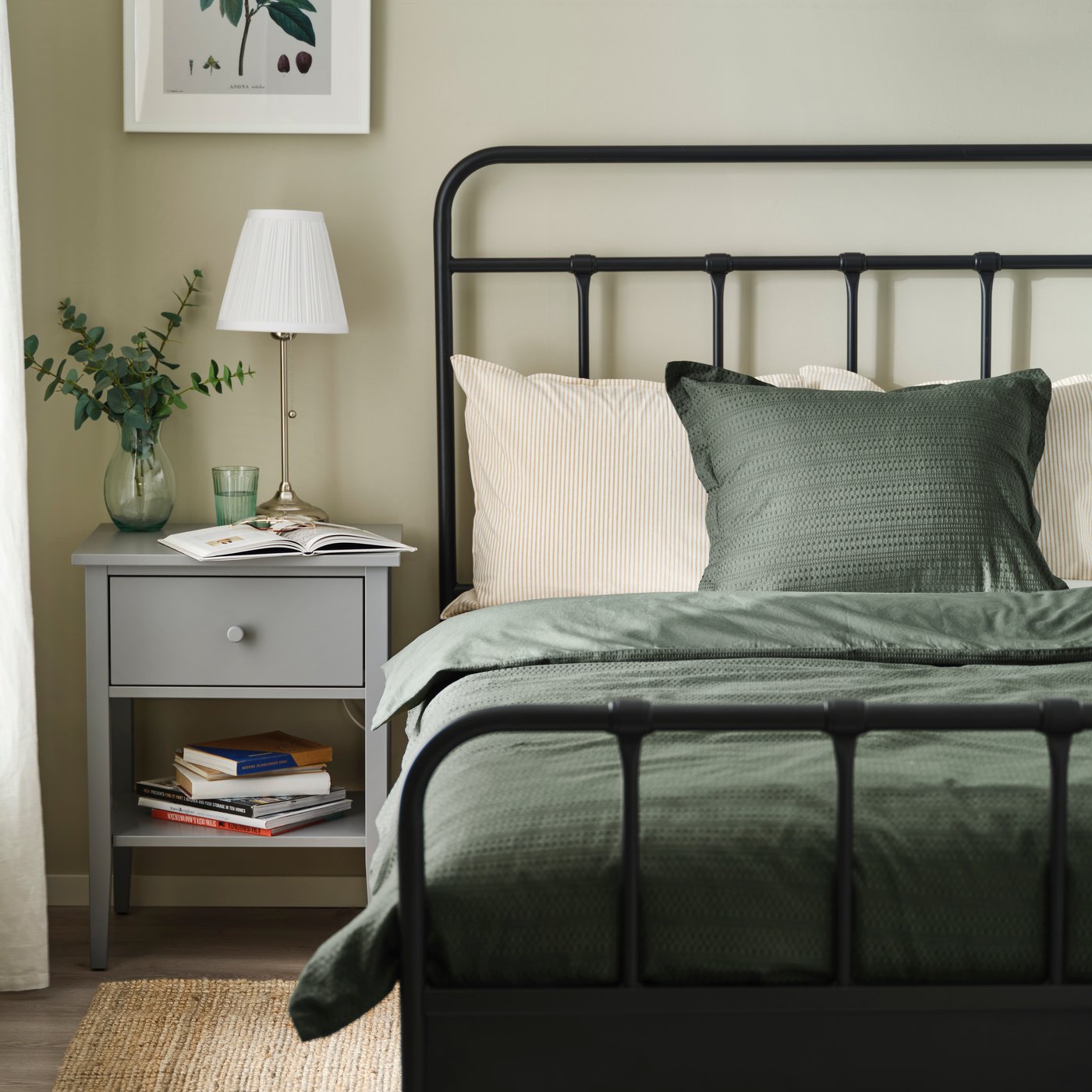 An anthracite STJÄRNÖ bed frame in the bedroom