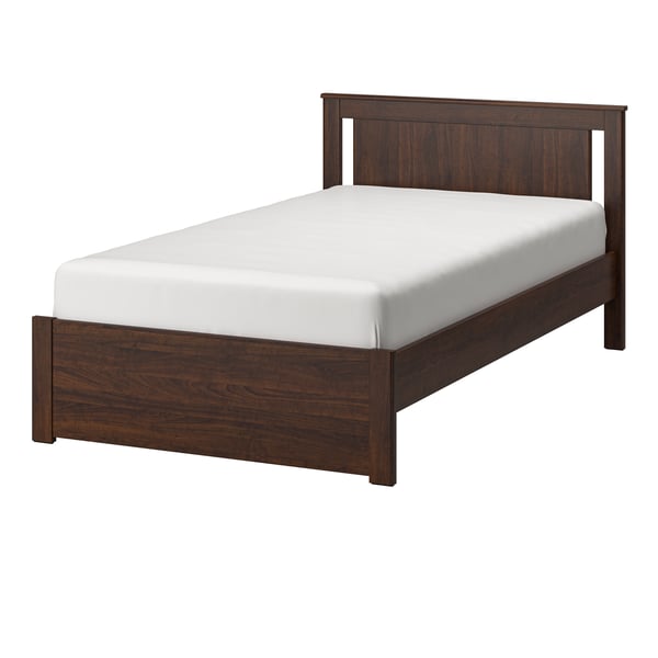 A brown SONGESAND bed frame in the NA