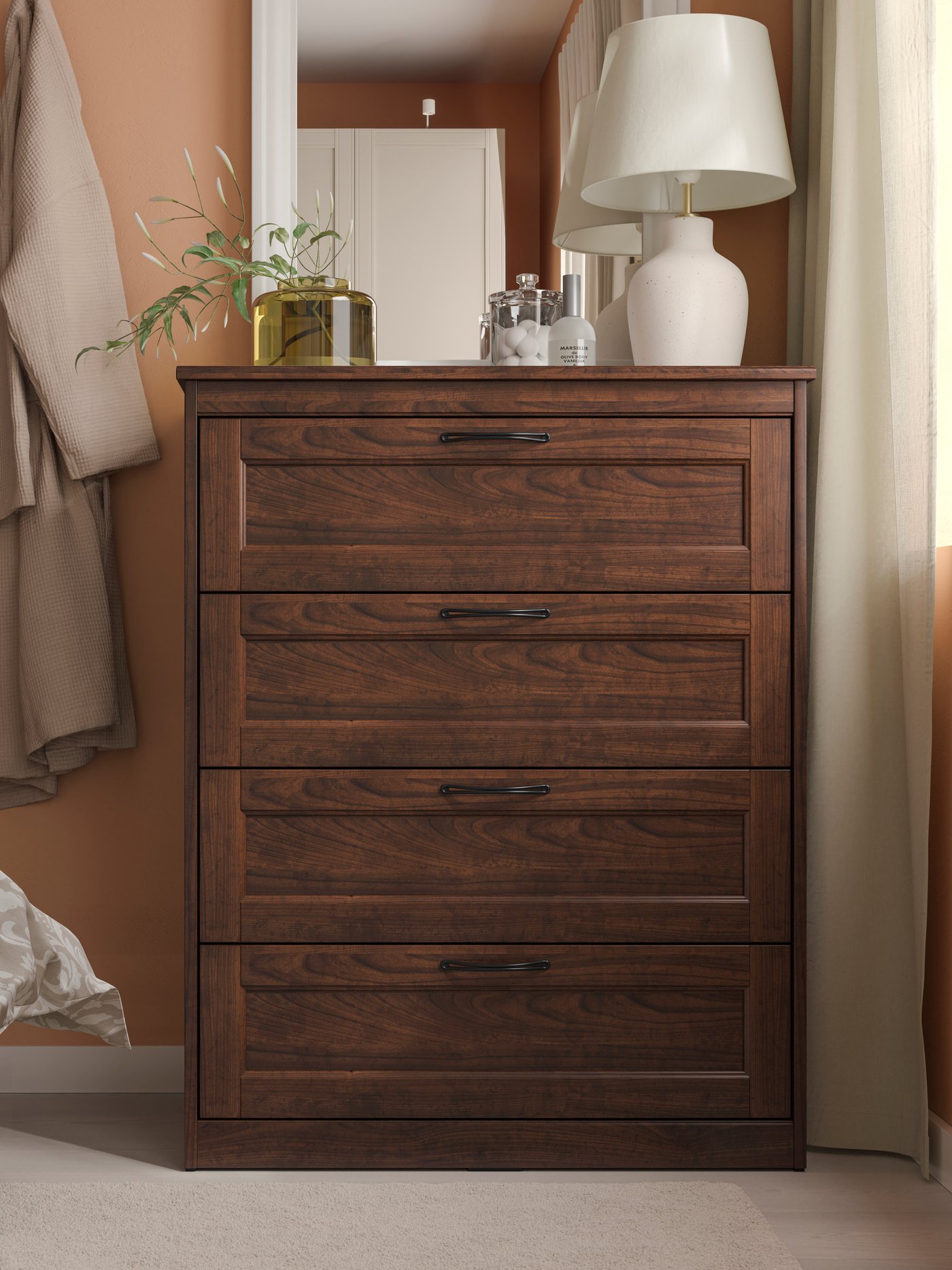 A brown SONGESAND chest of 4 drawers