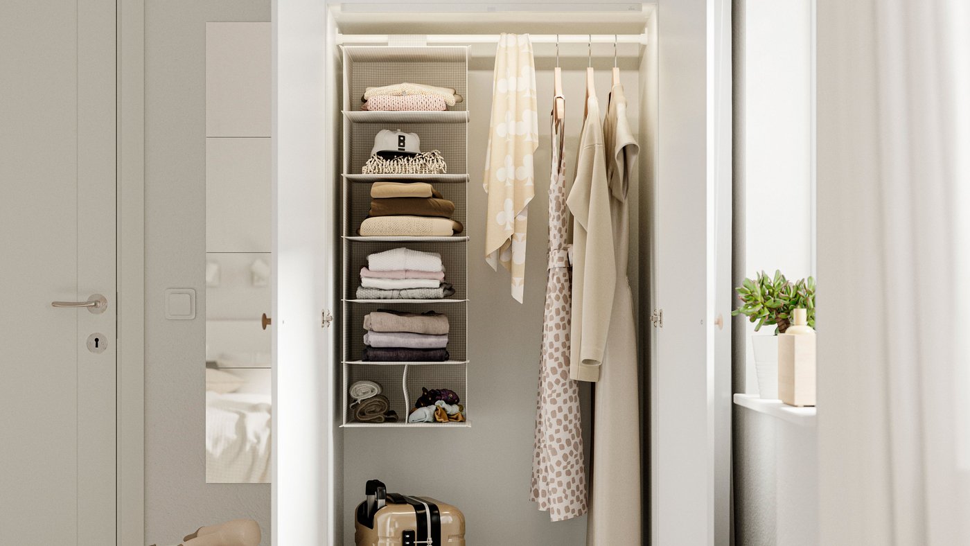A white LASTARE wardrobe combination in the bedroom