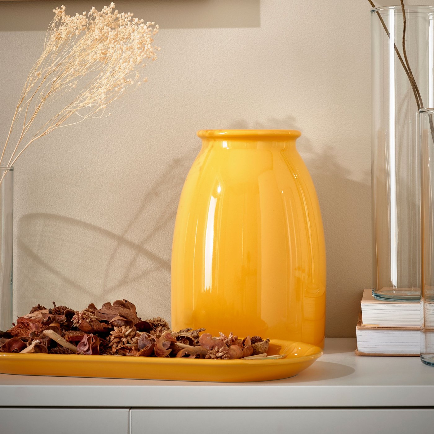 A bright yellow KOPPARBJÖRK vase ready for Deepavali celebrations