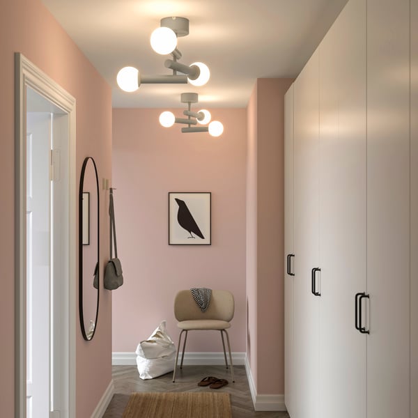 A black LINDBYN mirror in the hallway