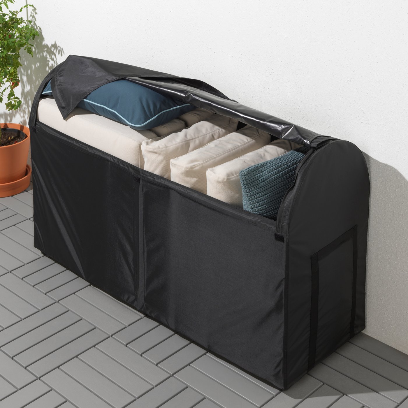 A black TOSTERÖ storage box, outdoor