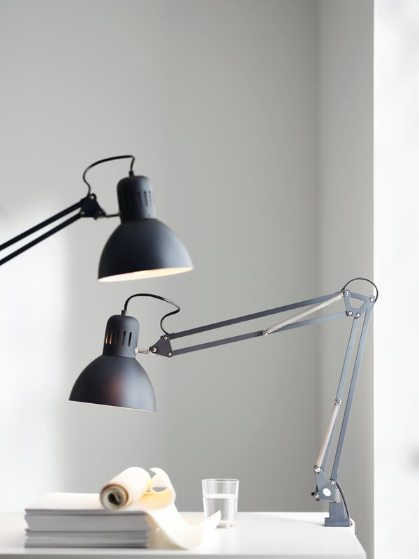 Minimalist black and white desk with two adjustable study lamps