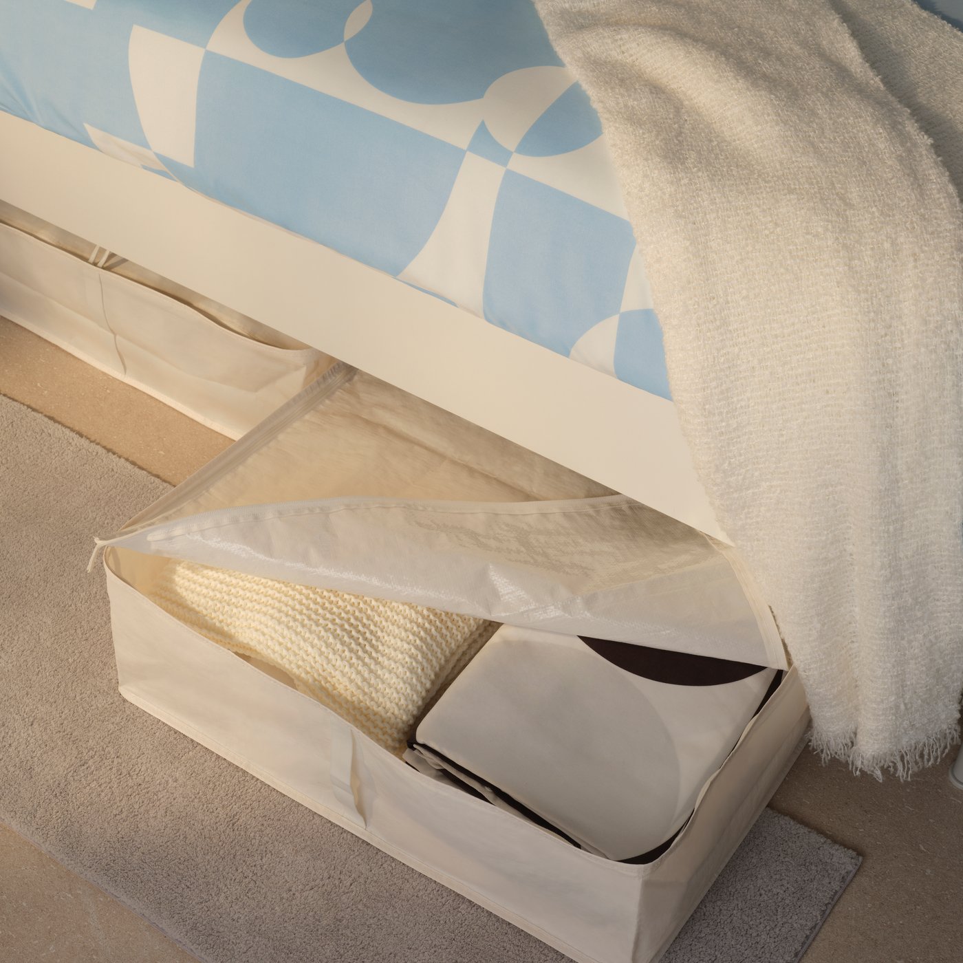 A white BRUKSVARA storage case in the bedroom