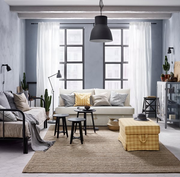 A spacious Scandi Style living room with a variety of seating solutions.