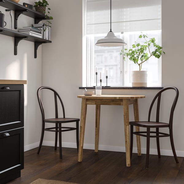 An acacia/dark brown NACKANÄS table and 2 chairs