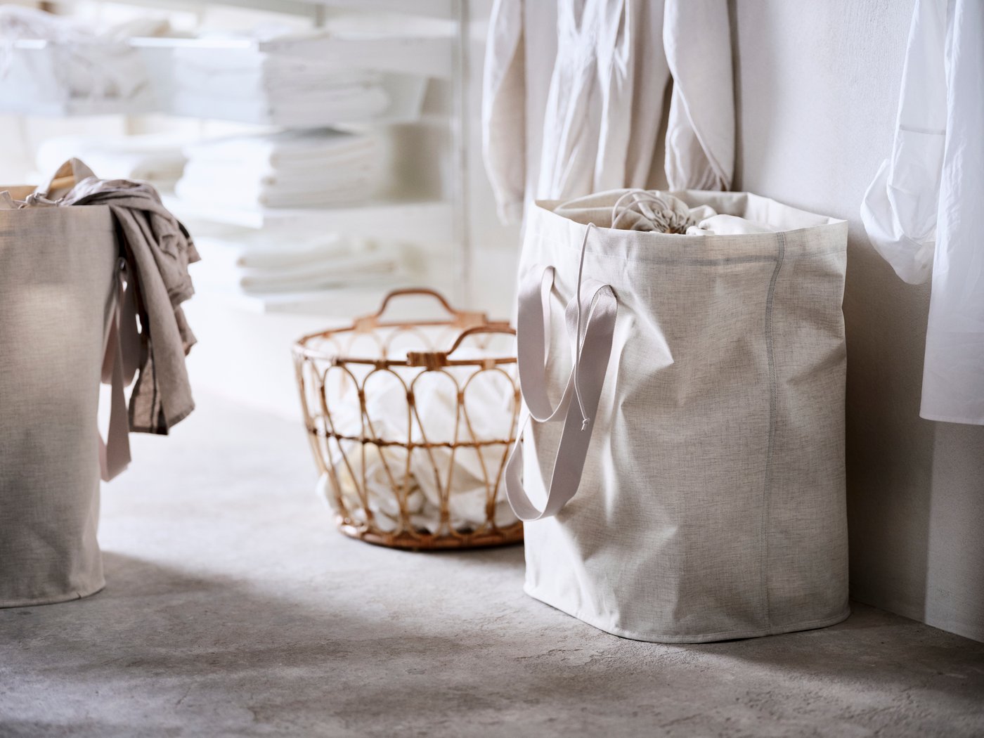 A rattan SNIDAD and PURRPINGLA basket in the laundry room.