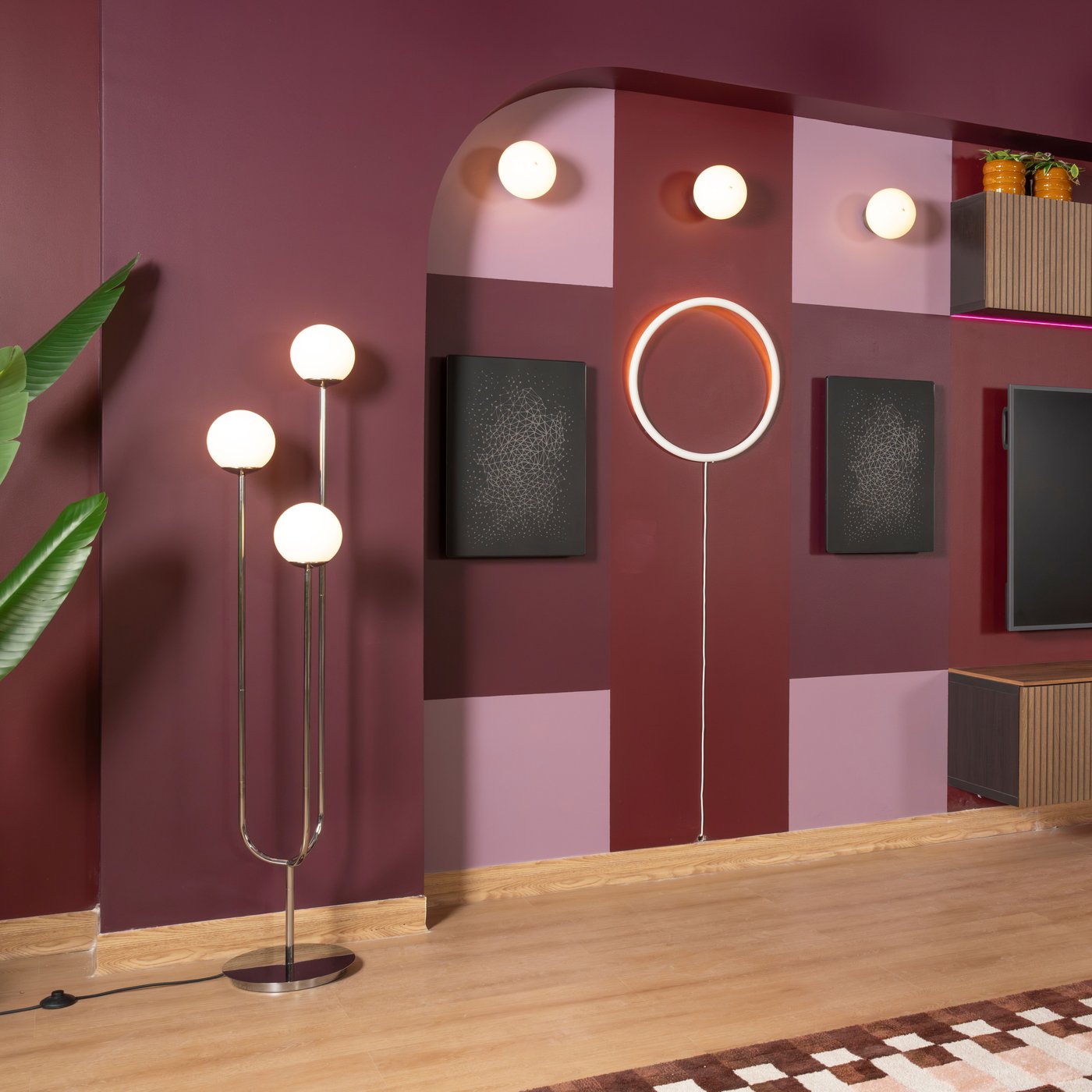A white metal/circle VARMBLIXT LED wall lamp in the living room